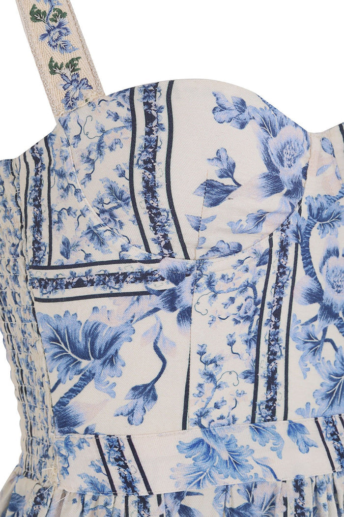 Nader Marcia Dress with structured bodice, blue pattern detail print on cream base with vertical striped panels and embroidered straps