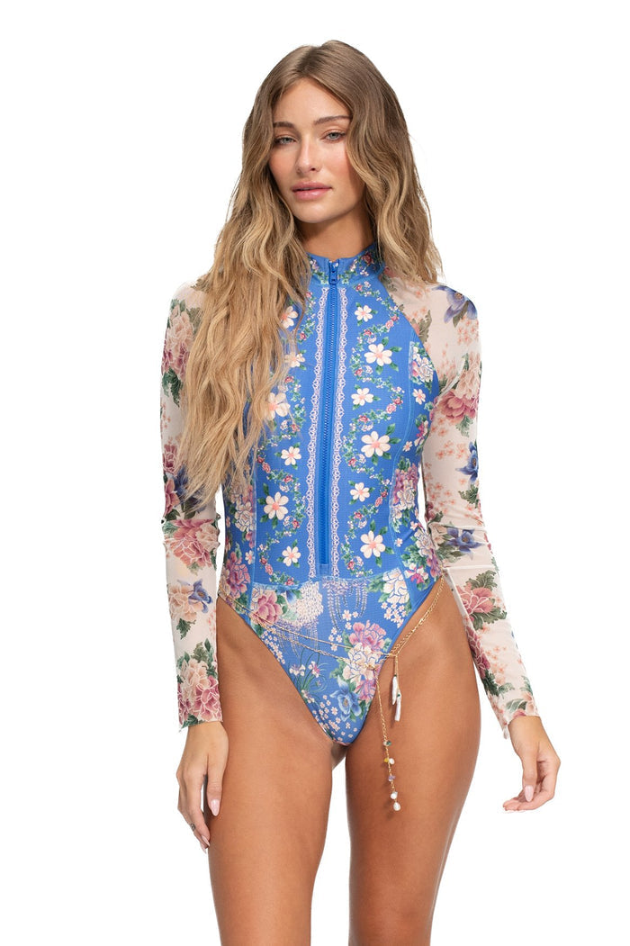 Blue long-sleeve one piece swimsuit with front zipper, pattern detail print on body and sheer mesh sleeves