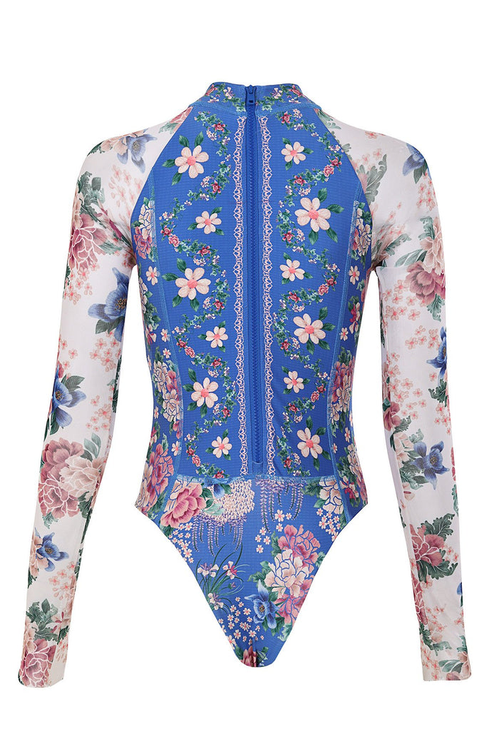 Nader Monti one-piece swimsuit with blue pattern detail center panel, white pattern detail mesh long sleeves, and front zipper
