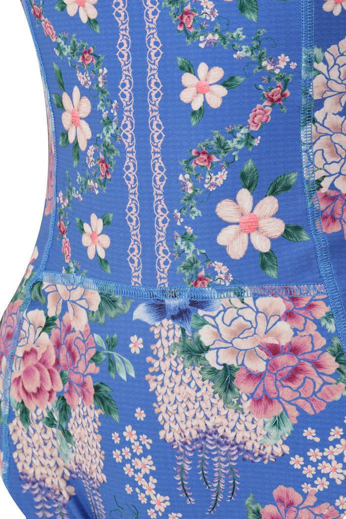Blue one-piece swimsuit with pattern detail print featuring pink blooms, vertical chain detailing, and mesh sleeves