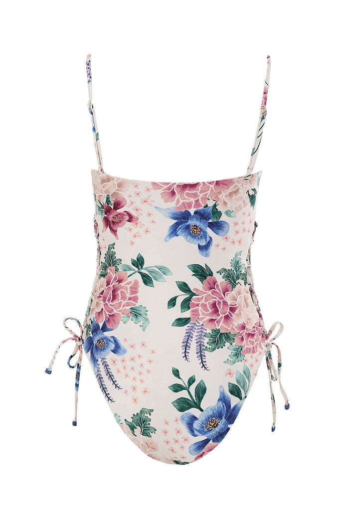 One-piece swimsuit with adjustable side ties, cream background with pink and blue floral print and green foliage