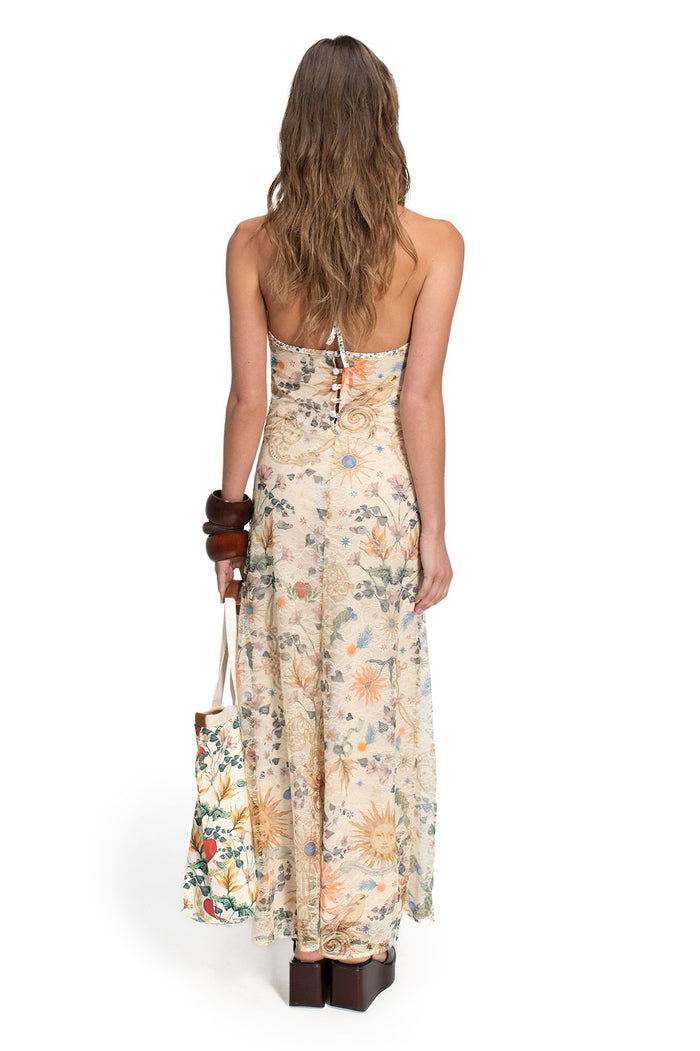 Nader Sari Dress in cream lace with pattern detail and sun print, halter neckline, back view showing button closure