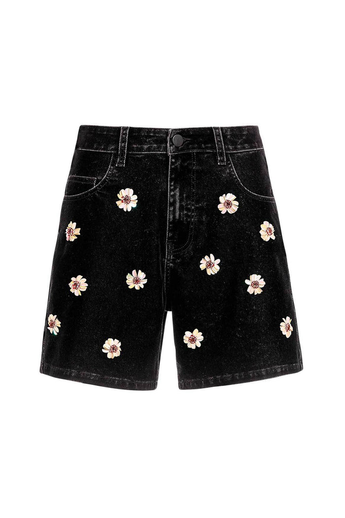 Black denim shorts with handmade white and pink floral embroidery scattered across the front