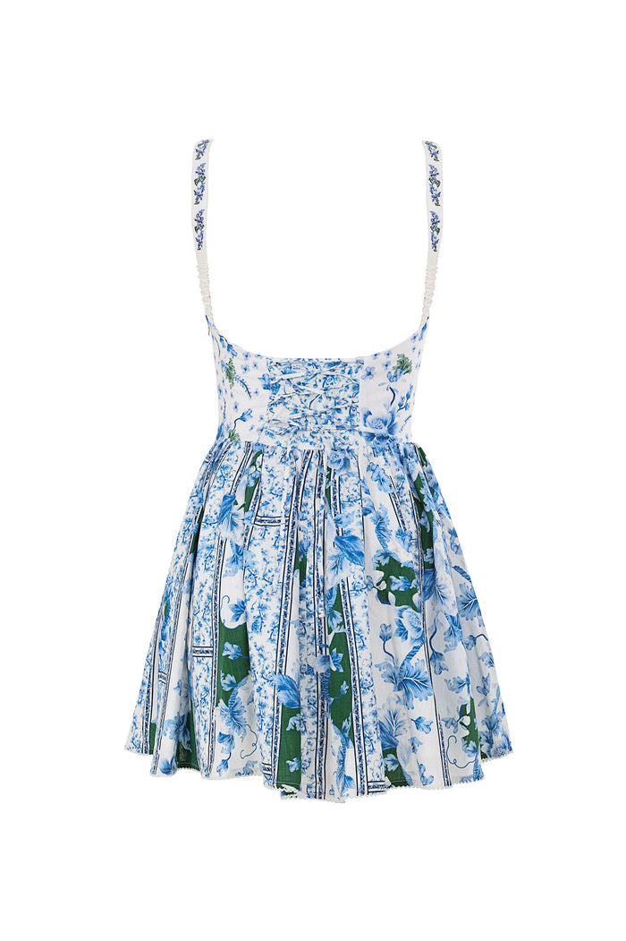 Nader Spring Dress in white with blue pattern detail print and green vertical stripes, featuring ruched bodice and flared skirt
