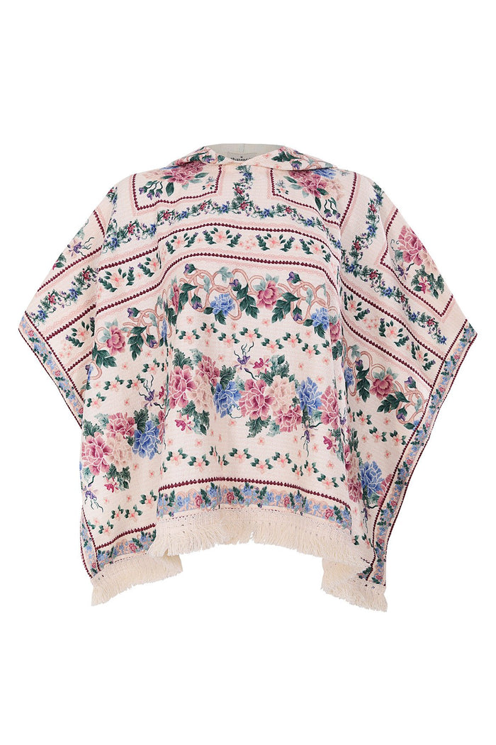 Nader Susy Kids' poncho towel in soft pink terry fabric with pattern detail placement print featuring pink and blue blooms, decorative ribbon borders…
