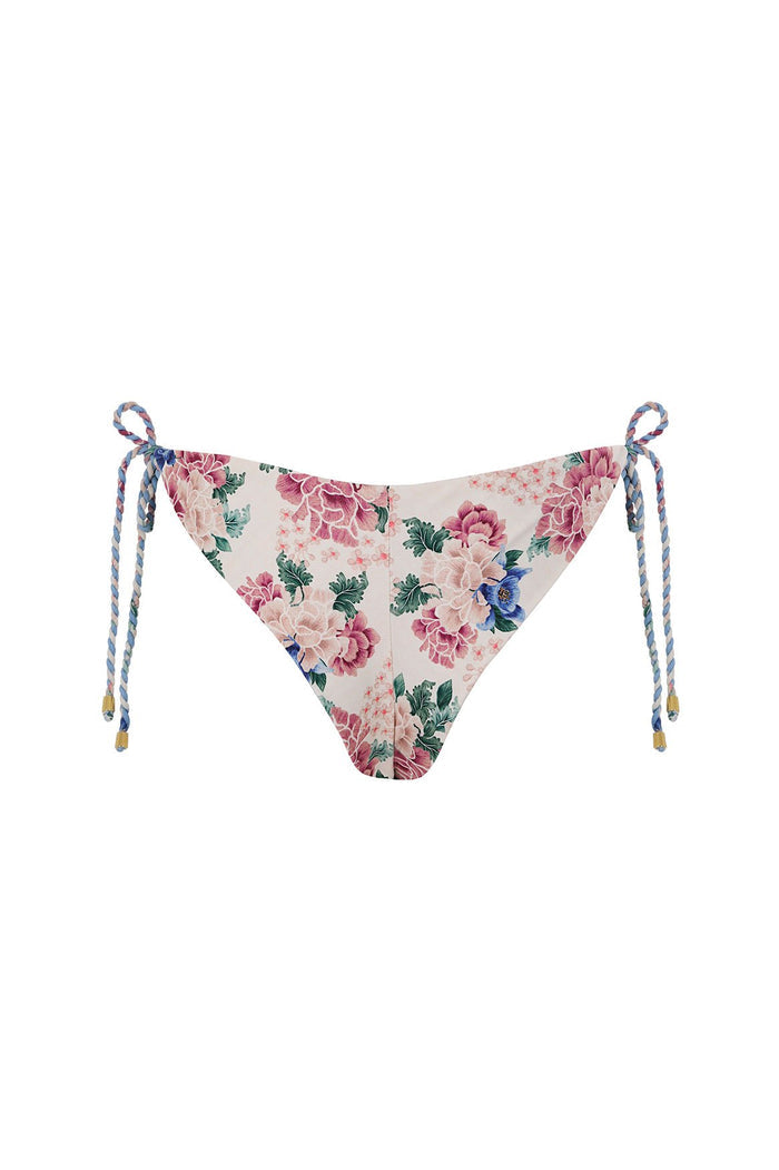 Nader Tammy bikini bottom in white with pink and blue pattern detail print, featuring braided blue and pink adjustable side ties with gold-tone tips