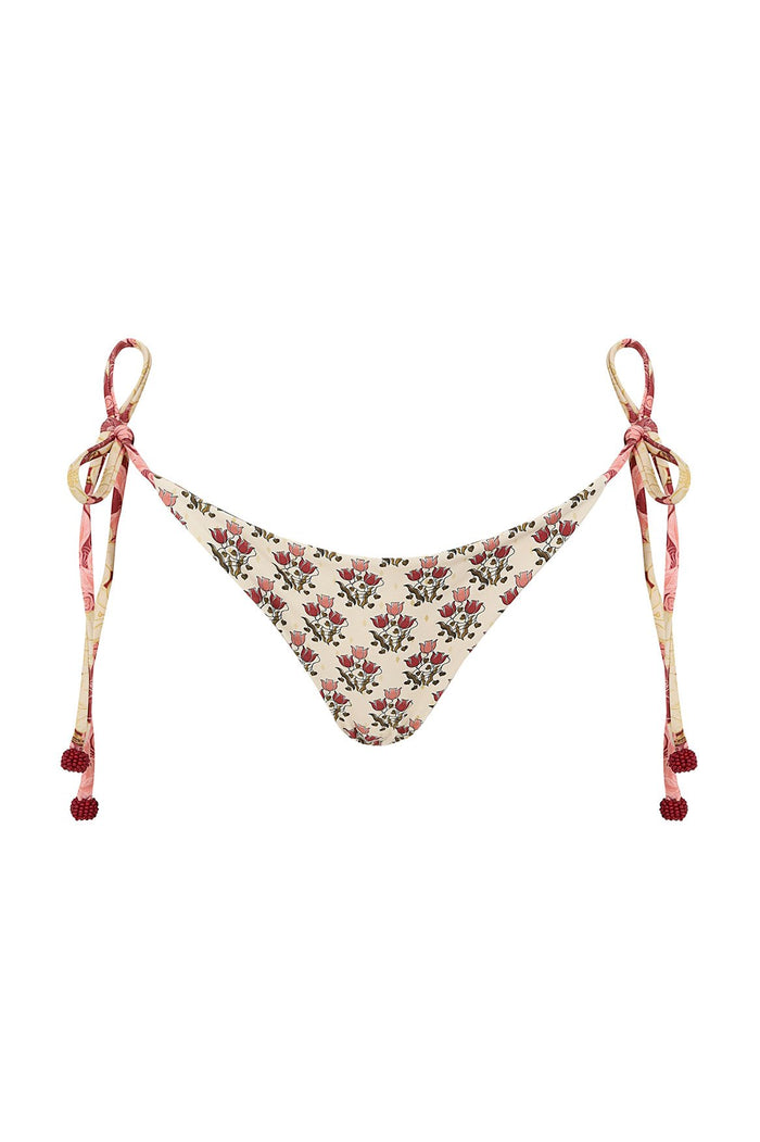 Nader Tammy bikini bottom in cream with red and pink pattern detail print, side ties with beaded tassels