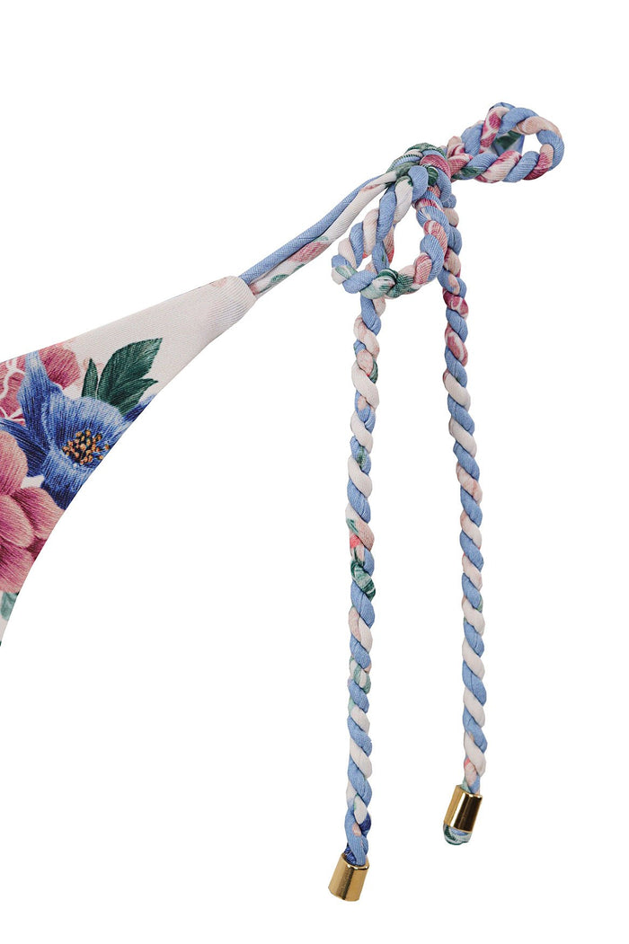 Tammy bikini bottom with braided side ties, pattern detail print in blue, pink, and green tones, reversible design with gold-tone cord ends