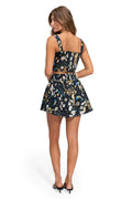 Black mini skirt with pattern detail and celestial print featuring gold decorative trim at waist
