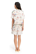 Nader Watts Shorts in cream with pink and blue floral print and white lace trim hem, back view