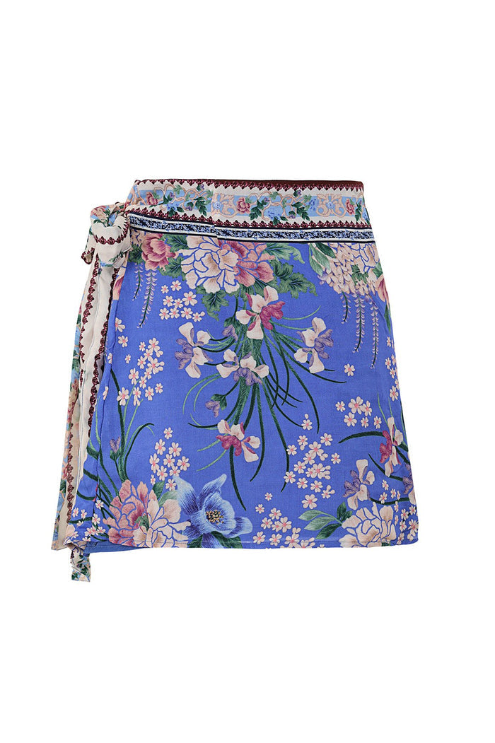 Nader Ziara wrap mini skirt in periwinkle blue with floral print, decorative border trim at waist, and side tie closure