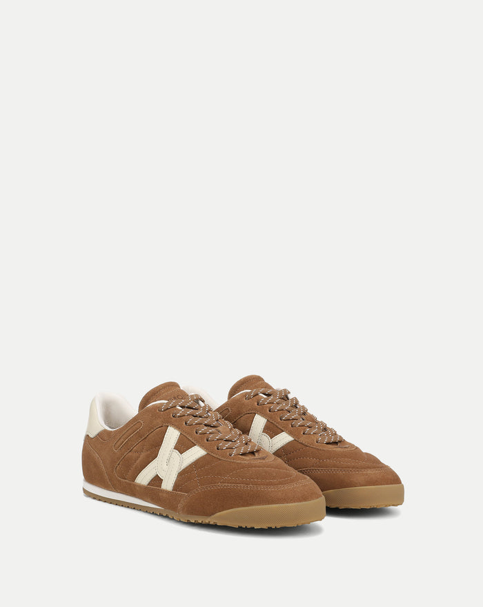 Veronica Beard Brown suede sneakers with white accents.