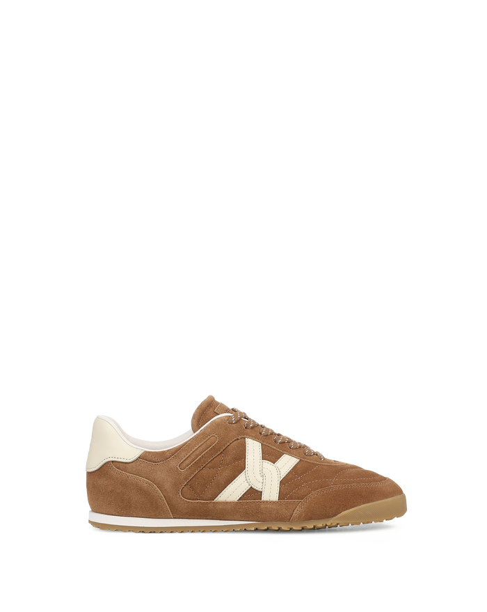 Veronica Beard Brown suede sneaker with cream accents.