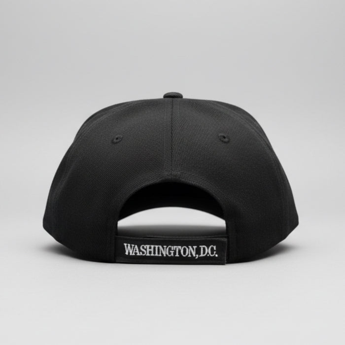 Black cap with 'Washington DC' logo on a reflective surface