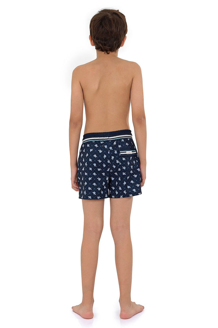 Navy blue swim trunks with all-over light blue scattered print, white striped elastic waistband, back view