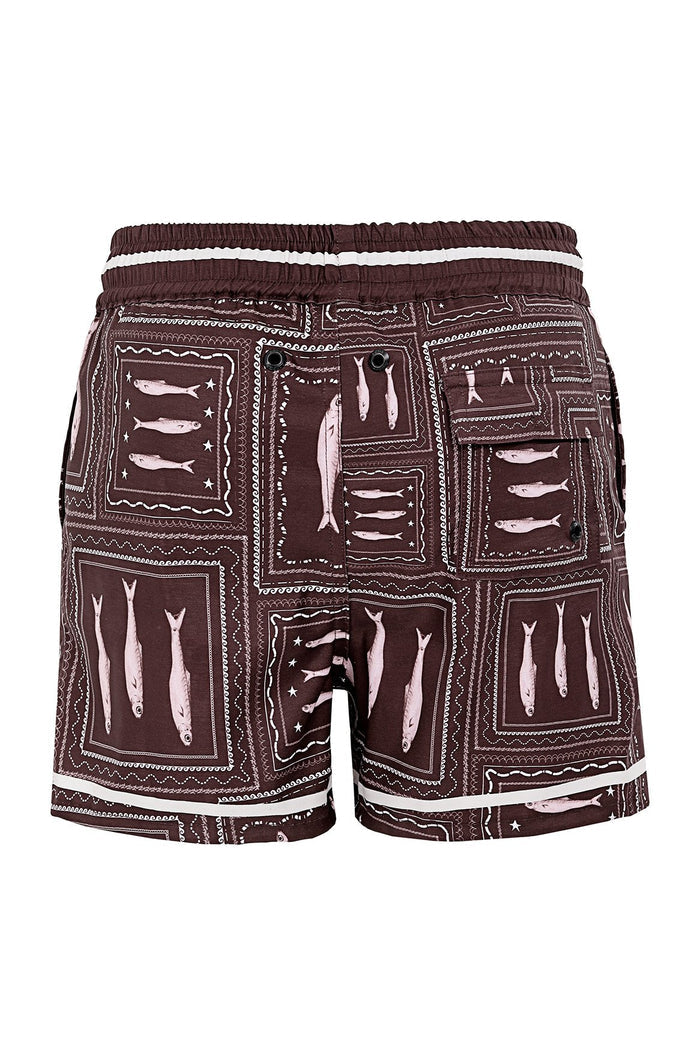 Brown swim trunks with pink and white geometric grid pattern and pattern detail silhouettes