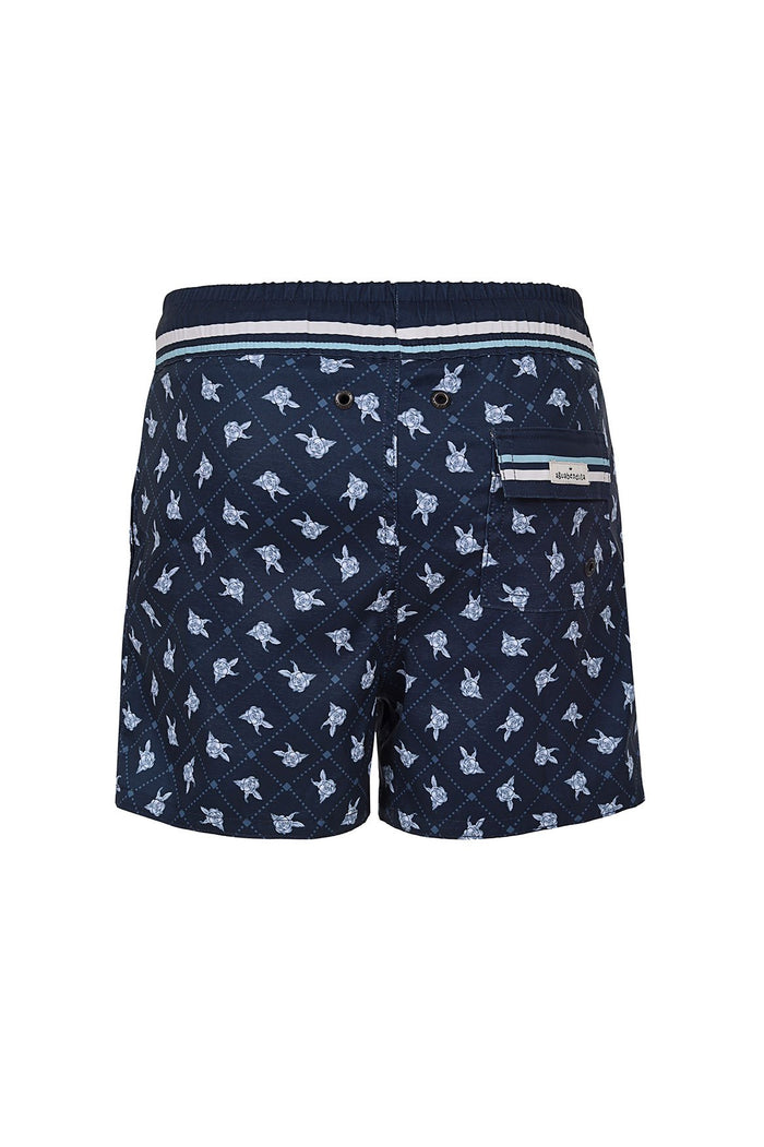 Navy swim trunks with light blue turtle print and diagonal grid pattern, elastic waistband with striped trim and back pocket