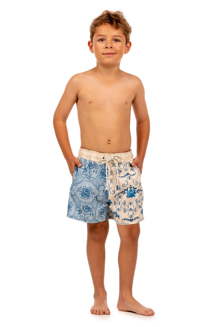 Boys' swim trunks with blue ornamental tile pattern on light background and drawstring waist