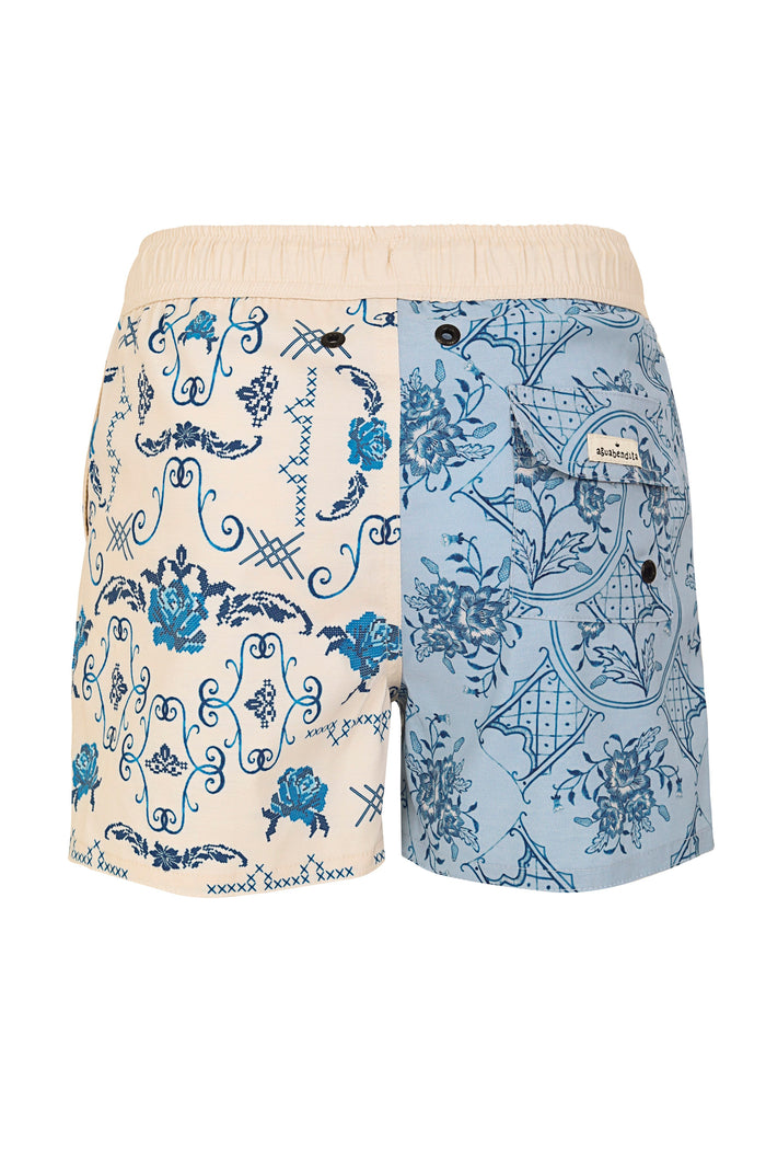 Nick Kids Trunks in cream and light blue with contrasting blue ornamental prints and cross-stitch details, back view