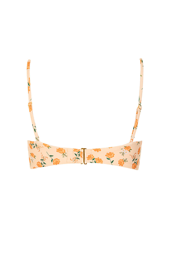Olly bikini top in peach with orange pattern detail print, adjustable straps, and gold hardware clasp