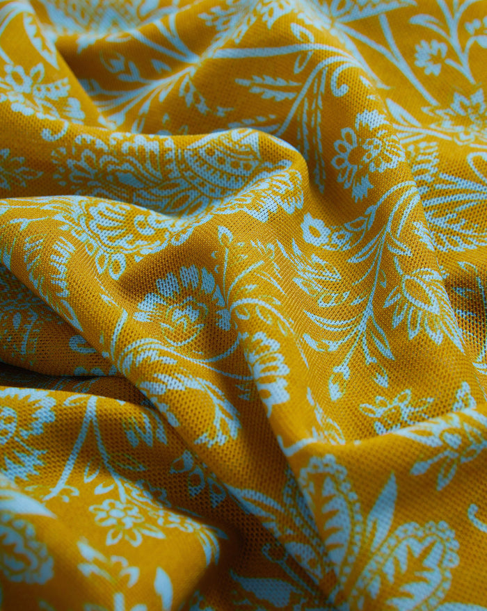 Veronica Beard Mustard yellow fabric with a light blue floral and paisley pattern.