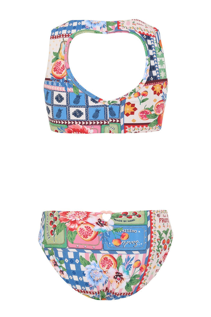 Paz Kids bikini set with multicolor patchwork print featuring geometric tiles, pattern detail blooms, pomegranates, and decorative emblem squares