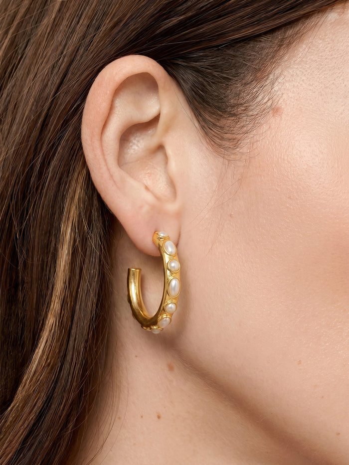 Veronica Beard Gold hoop earring with small white pearls embedded.