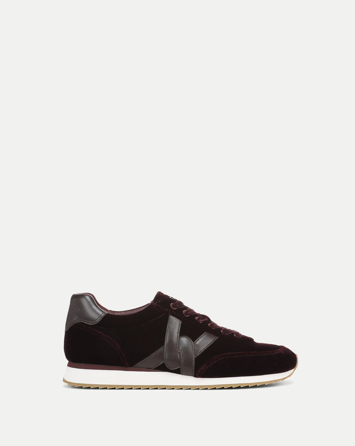 Veronica Beard Burgundy velvet and leather sneakers with white soles.