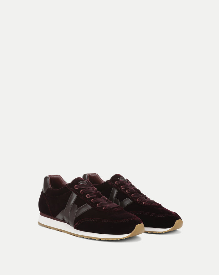 Veronica Beard Burgundy velvet sneakers with brown leather accents.