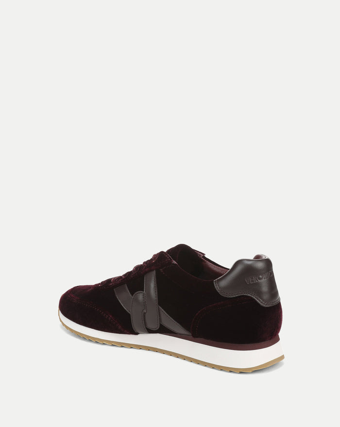 Veronica Beard Burgundy velvet sneakers with brown leather accents.