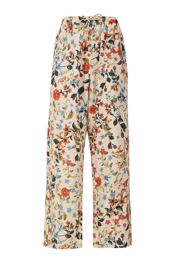 Rene Pants in cream with all-over floral print featuring orange, blue, and pink blossoms with green foliage and elastic waistband