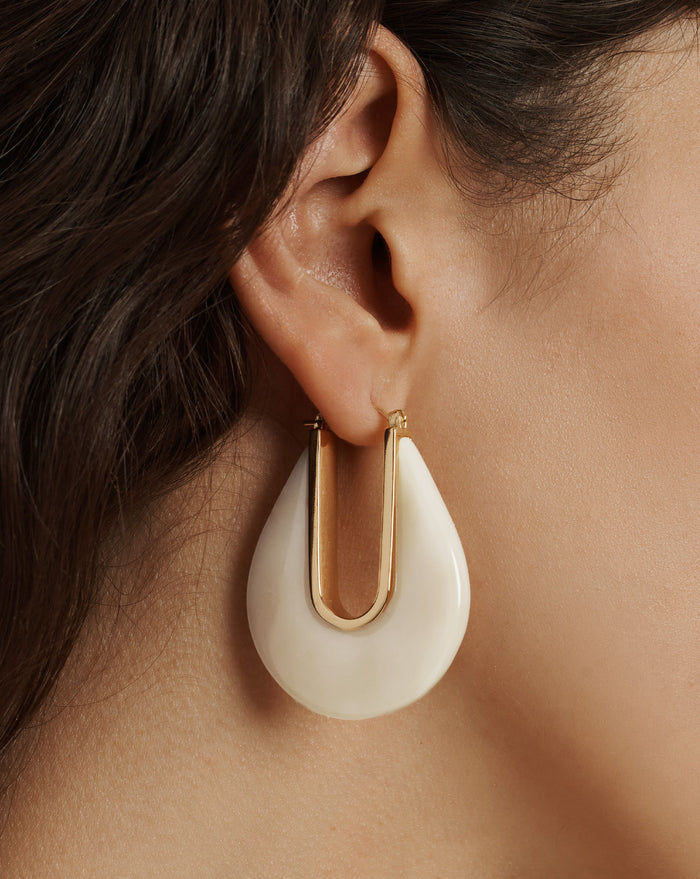 Veronica Beard White teardrop earrings with a gold-tone U-shaped insert.