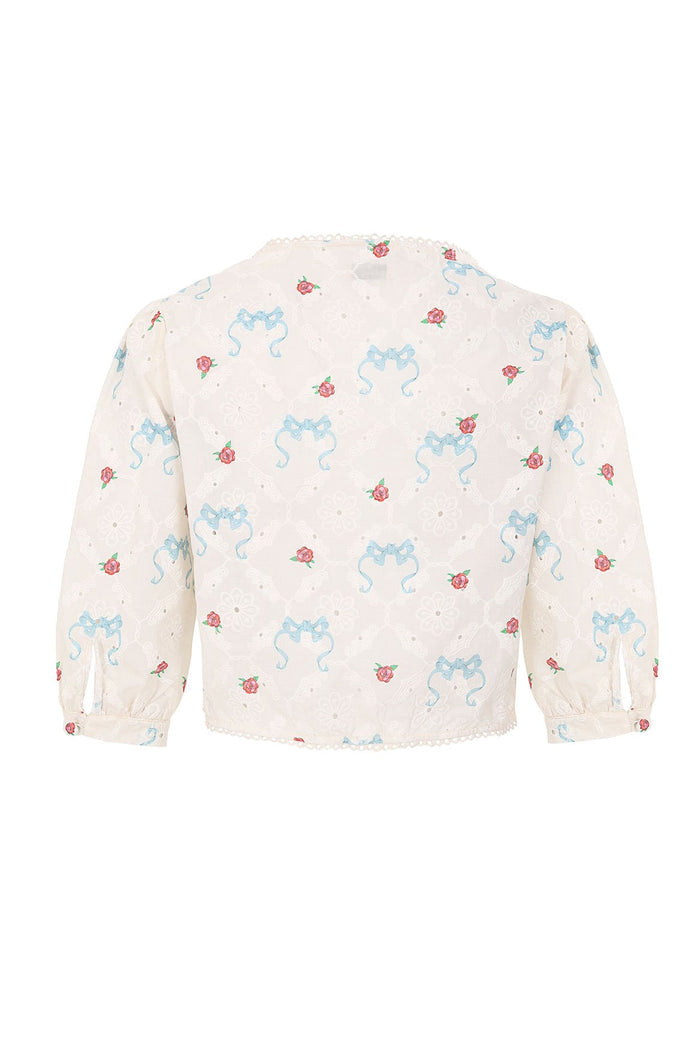 Salen Shirt in cream eyelet fabric with blue ribbon bow print and scattered pink rose details, three-quarter sleeves with elastic cuffs