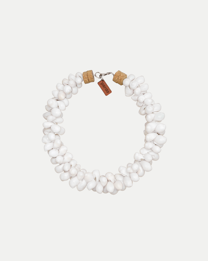 Veronica Beard White shell necklace with cork ends and a brown tag.