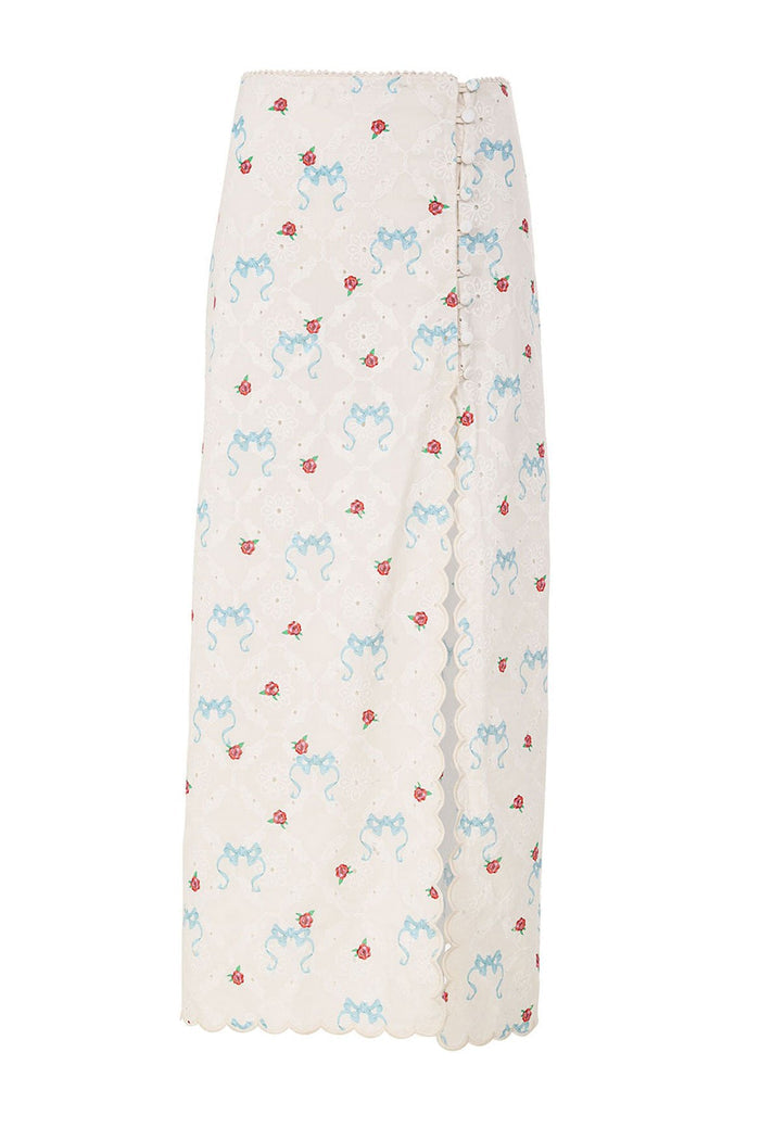 White eyelet maxi skirt with blue ribbon and red pattern detail print, scalloped trim and side button closure
