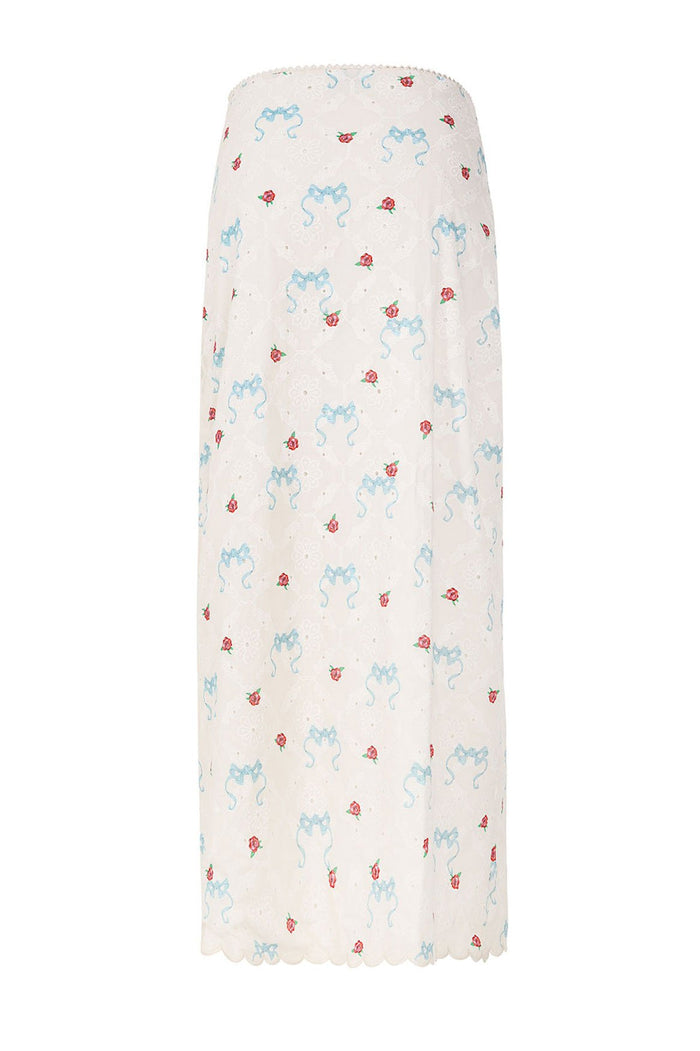 White maxi skirt with eyelet fabric, blue bow embroidery and red rose print throughout