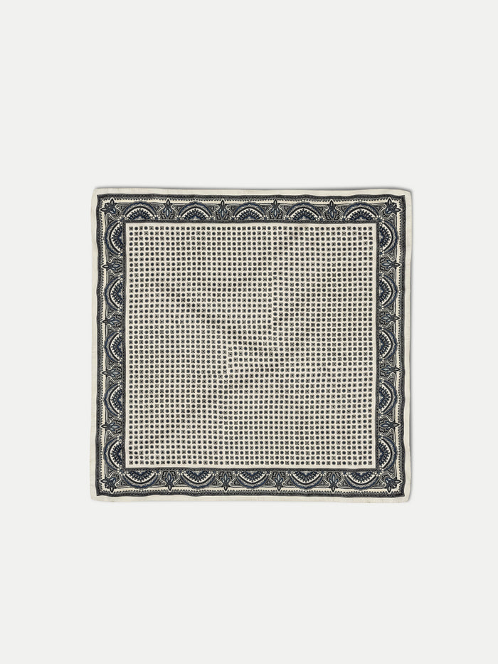 Veronica Beard White silk pocket square with black and purple geometric pattern.