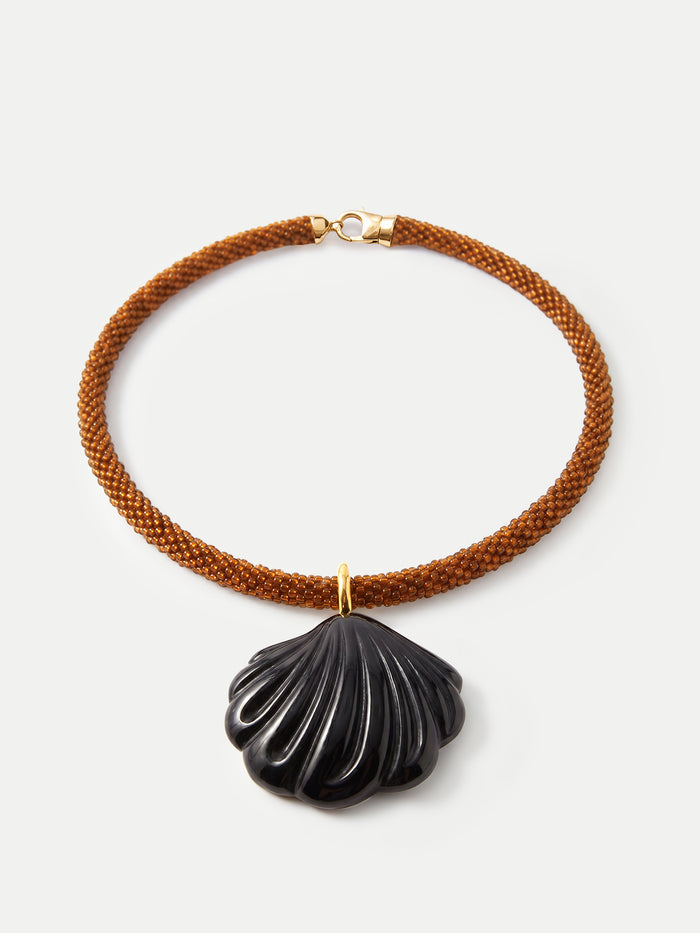 Veronica Beard Brown beaded necklace with a black shell pendant.
