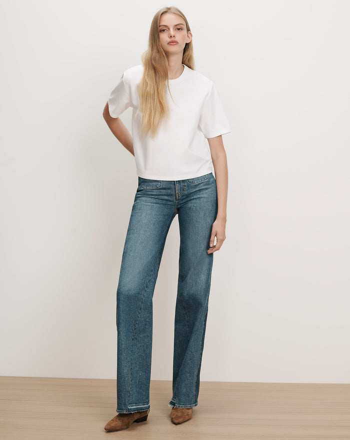Veronica Beard White cotton t-shirt and blue denim jeans.