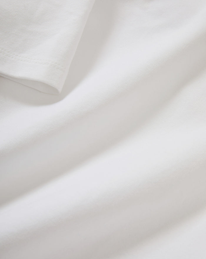 Veronica Beard White cotton t-shirt, close-up of fabric texture.