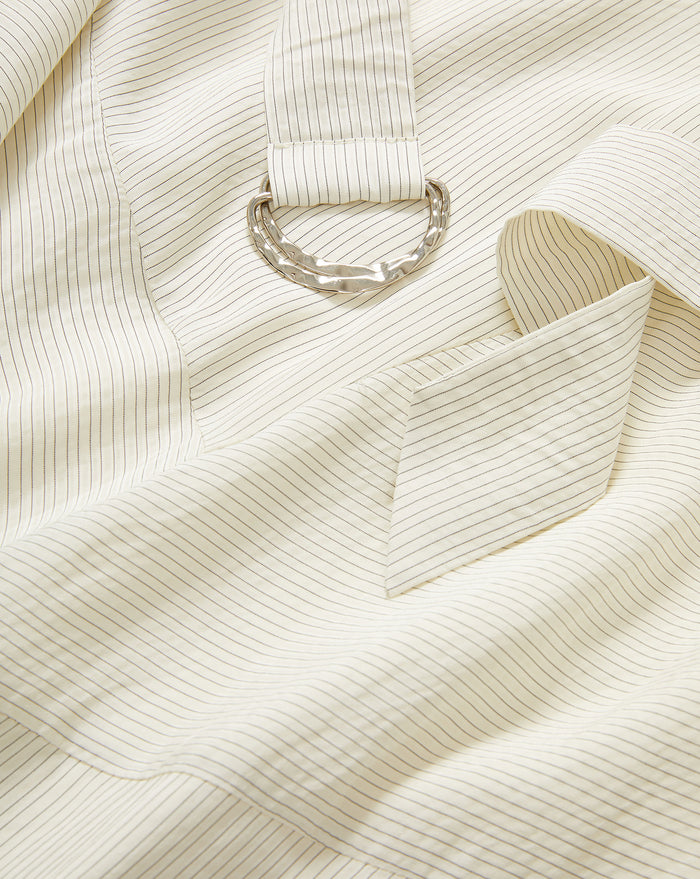 Veronica Beard Cream pinstriped cotton shirt with a silver-tone D-ring detail.