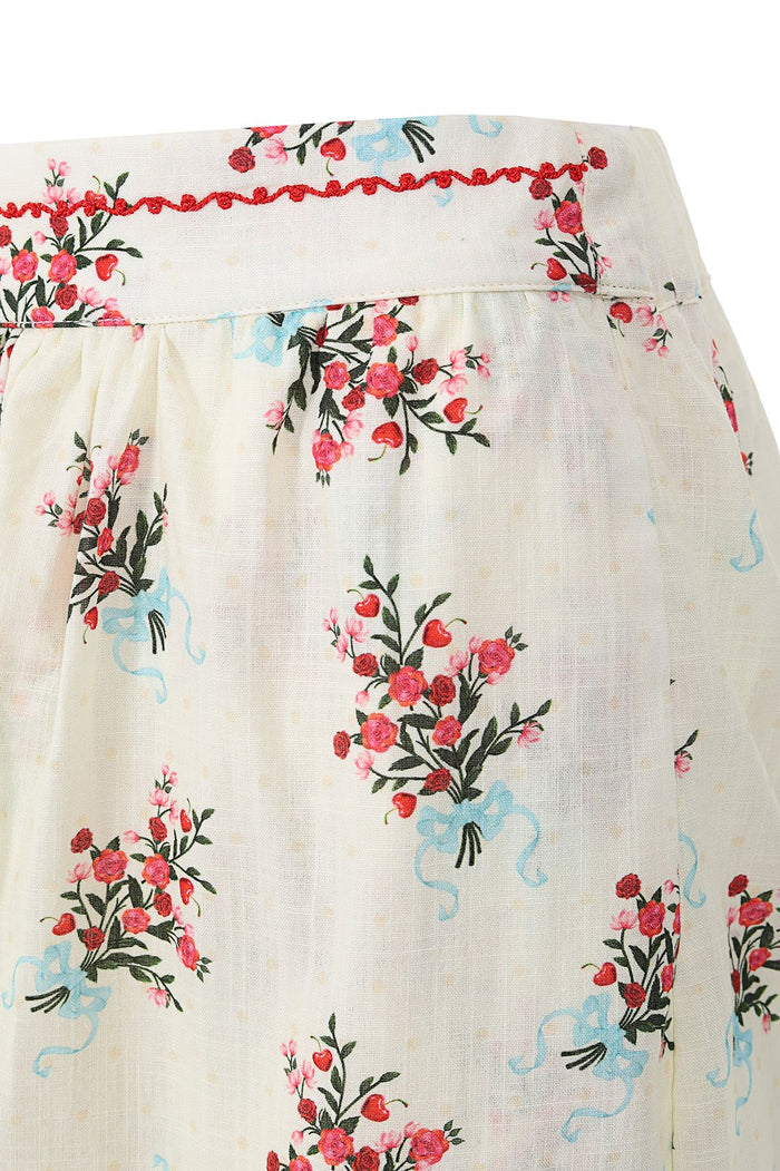 Silvia Pants in cream with floral bouquets tied with blue ribbons and red crochet trim at waistband