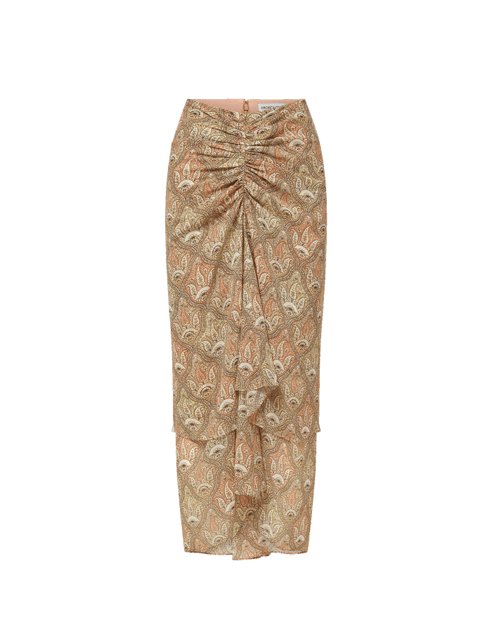 Veronica Beard Ribbed cream tank top and a sheer, ruched midi skirt with a beige paisley print and a matching belt.