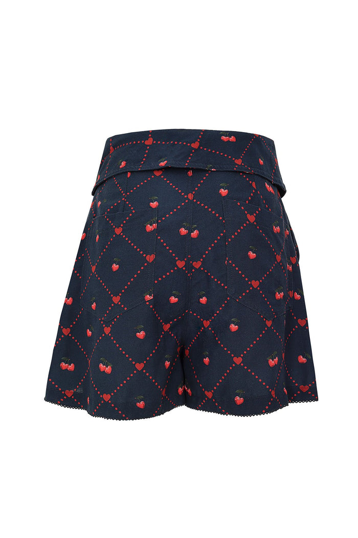 Navy blue shorts with red dotted lattice pattern and cherry print, belted waist with scalloped hem
