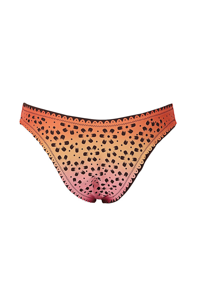 Tabita bikini bottom in coral to pink gradient with laser-cut pattern detail eyelet pattern and zigzag trim detailing