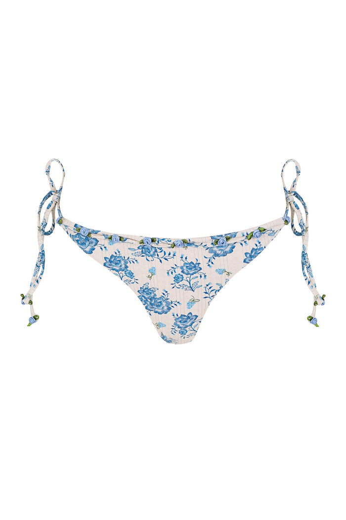 Tammy bikini bottom in cream with blue pattern detail print and adjustable side ties with beaded ends