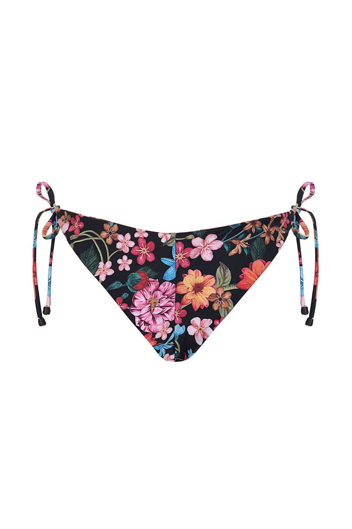 Tammy bikini bottom with side tie-ends in black fabric with vibrant pattern detail print featuring pink, orange, yellow, and blue blooms with green l…