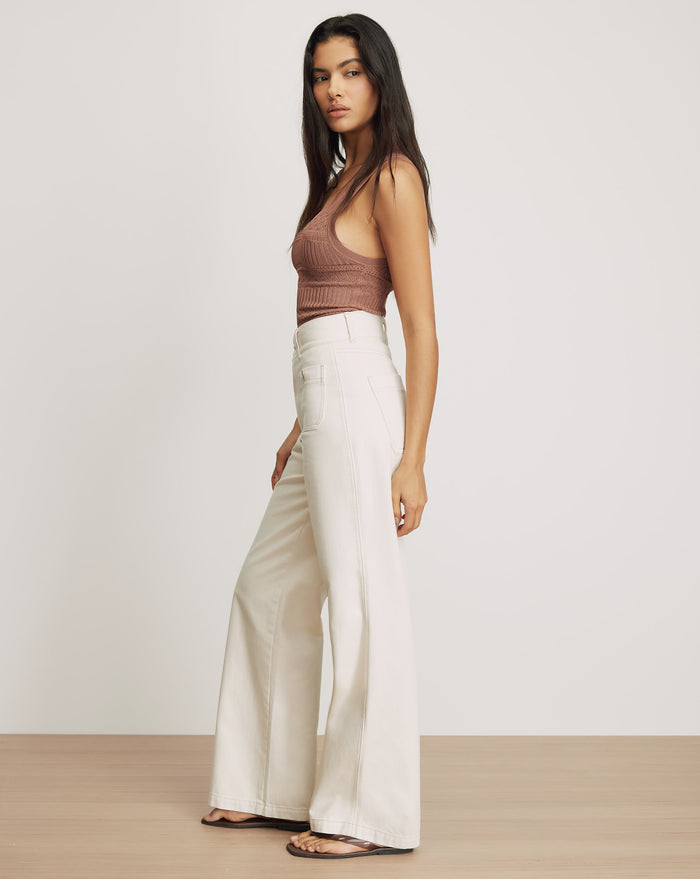 Veronica Beard White wide-leg jeans with visible stitching.