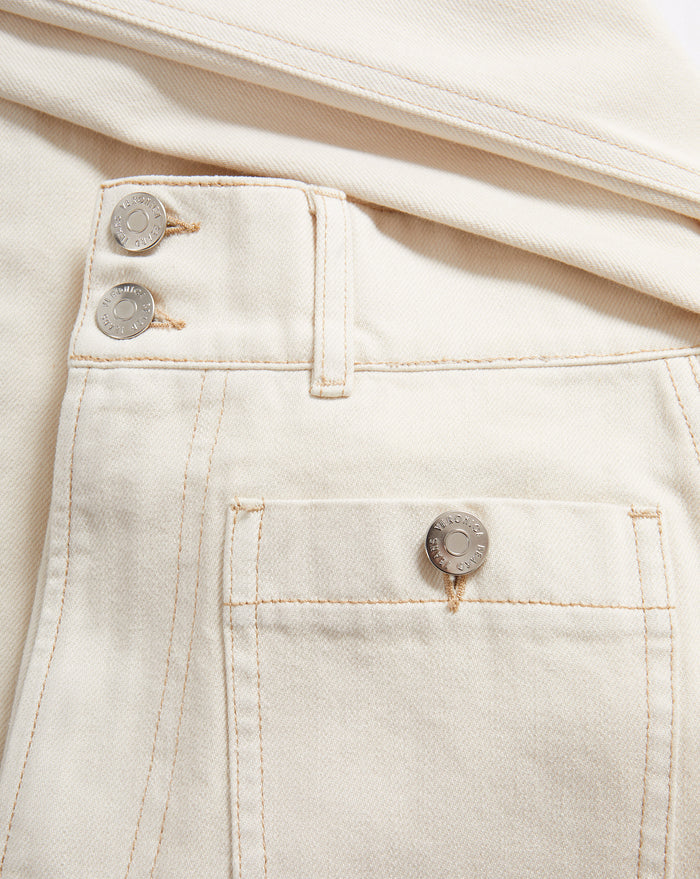 Veronica Beard Cream denim jeans with button fly and patch pocket.