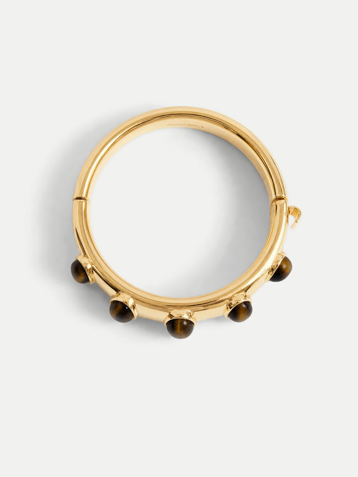 Veronica Beard Gold hinged bangle bracelet with round stones.